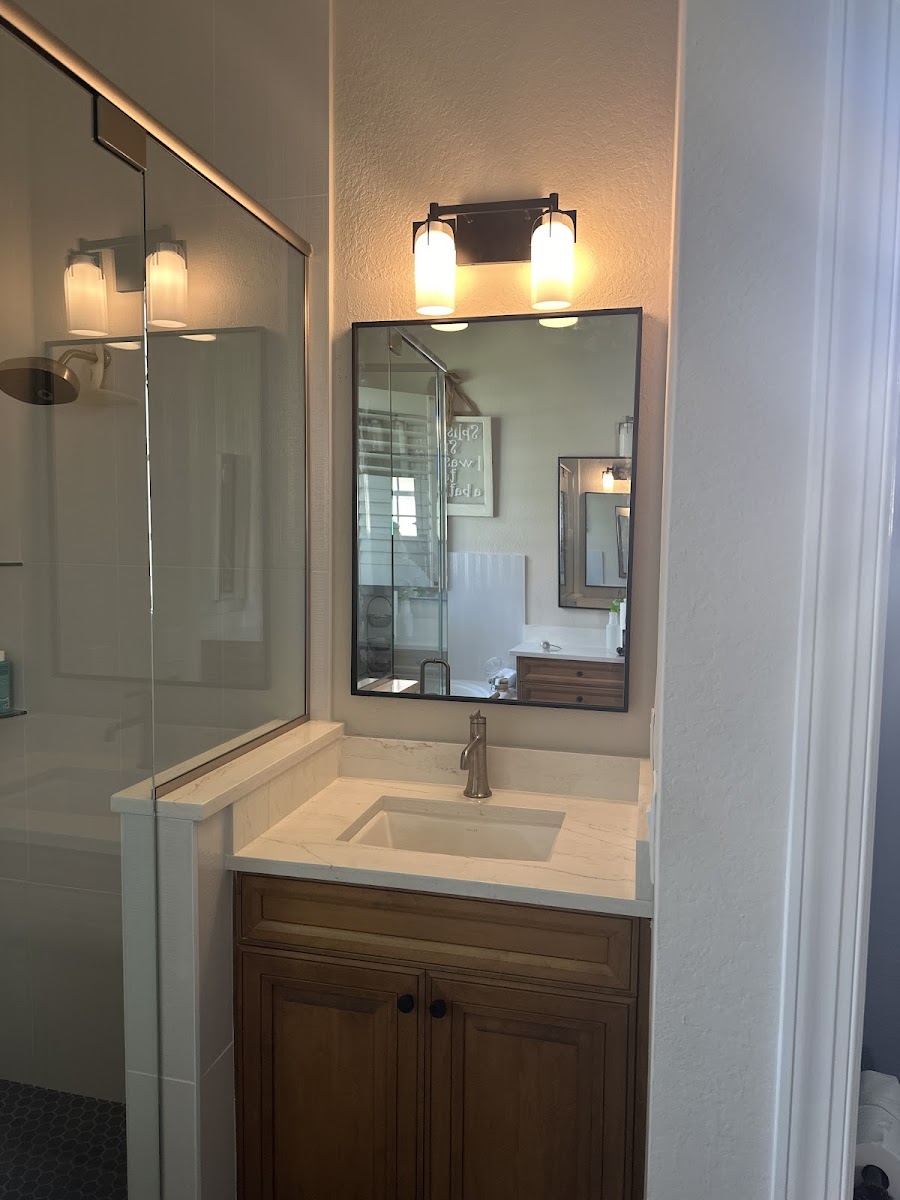Bathroom vanity, mirror, and lighting installation